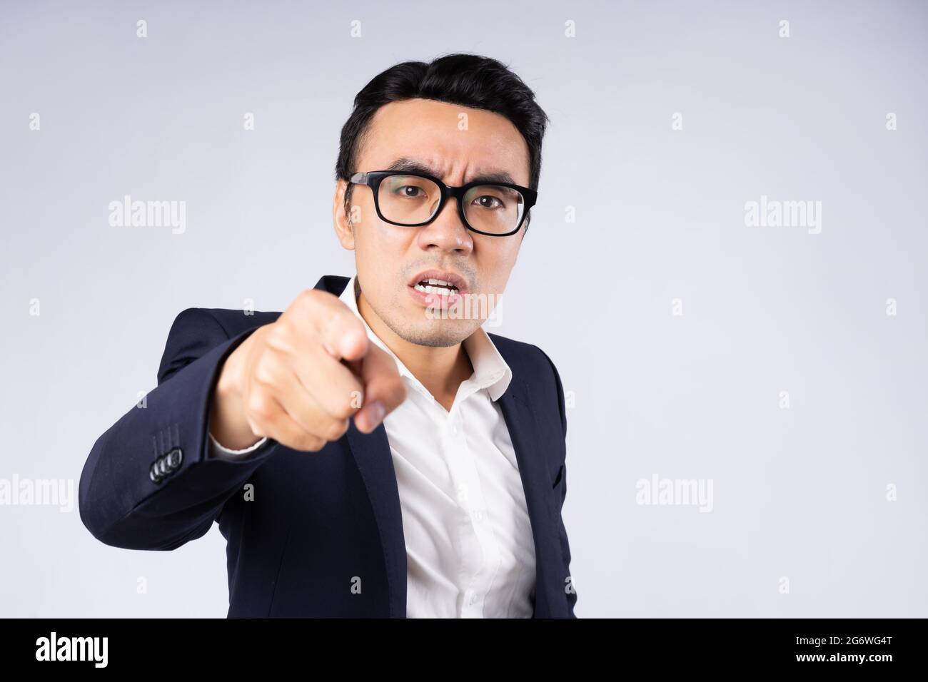 Portrait of business man wearing suit, isolated on white background ...
