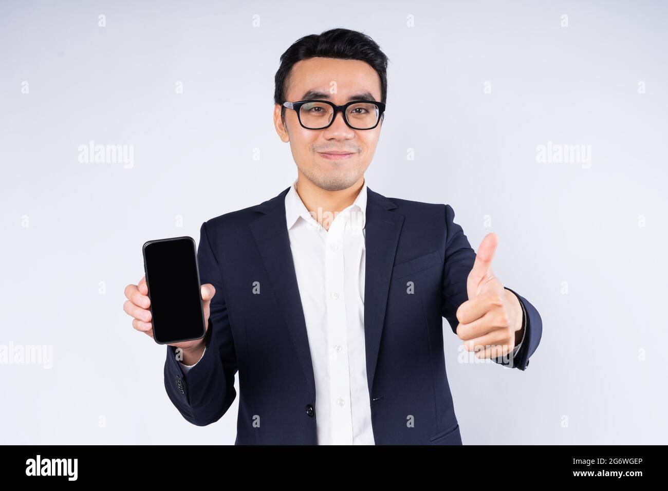 Portrait of business man wearing suit, isolated on white background ...