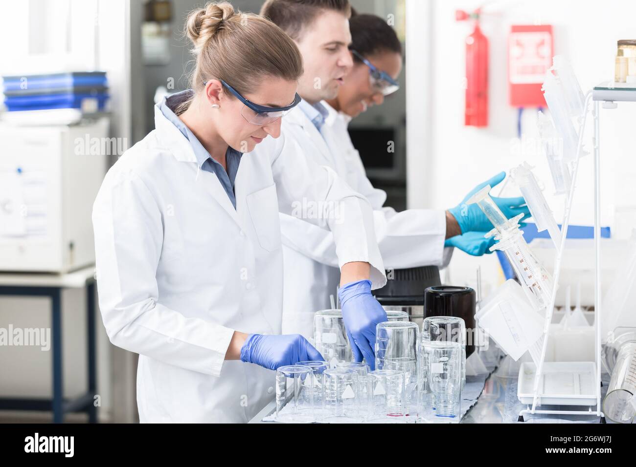 Scientists in research lab with safety goggles Stock Photo