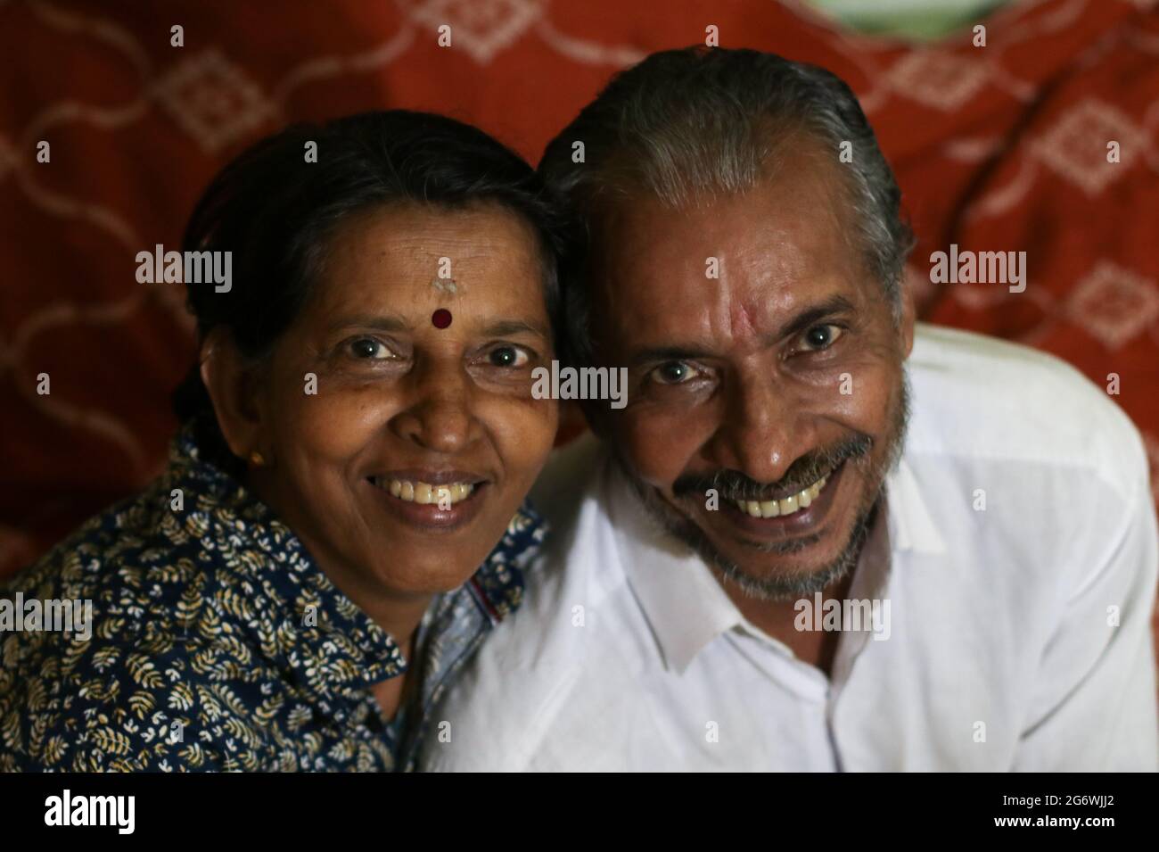old couple in love looking at the camera and smiling cheerfully Stock Photo