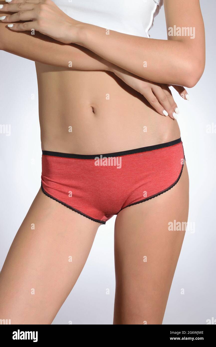 Different models of women's panties on a beautiful body of a young athletic and healthy girl isolated on a white background Stock Photo