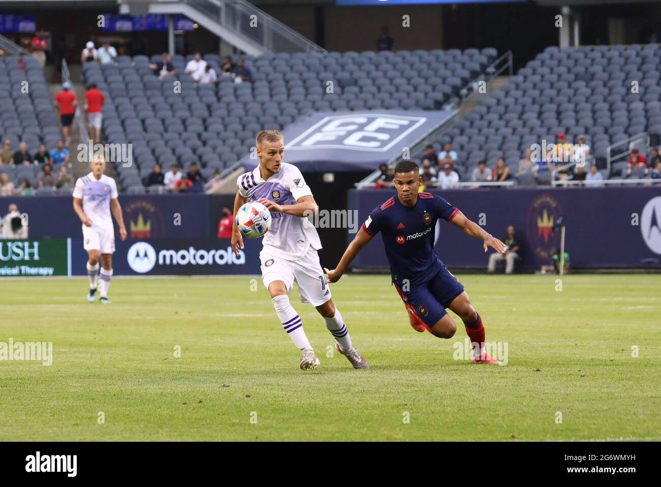 Chicago Fire defender Miguel Angel Navarro (6) and Orlando City forward Silvester van der Water (14) battle for the ball during a MLS match at Soldier Stock Photo