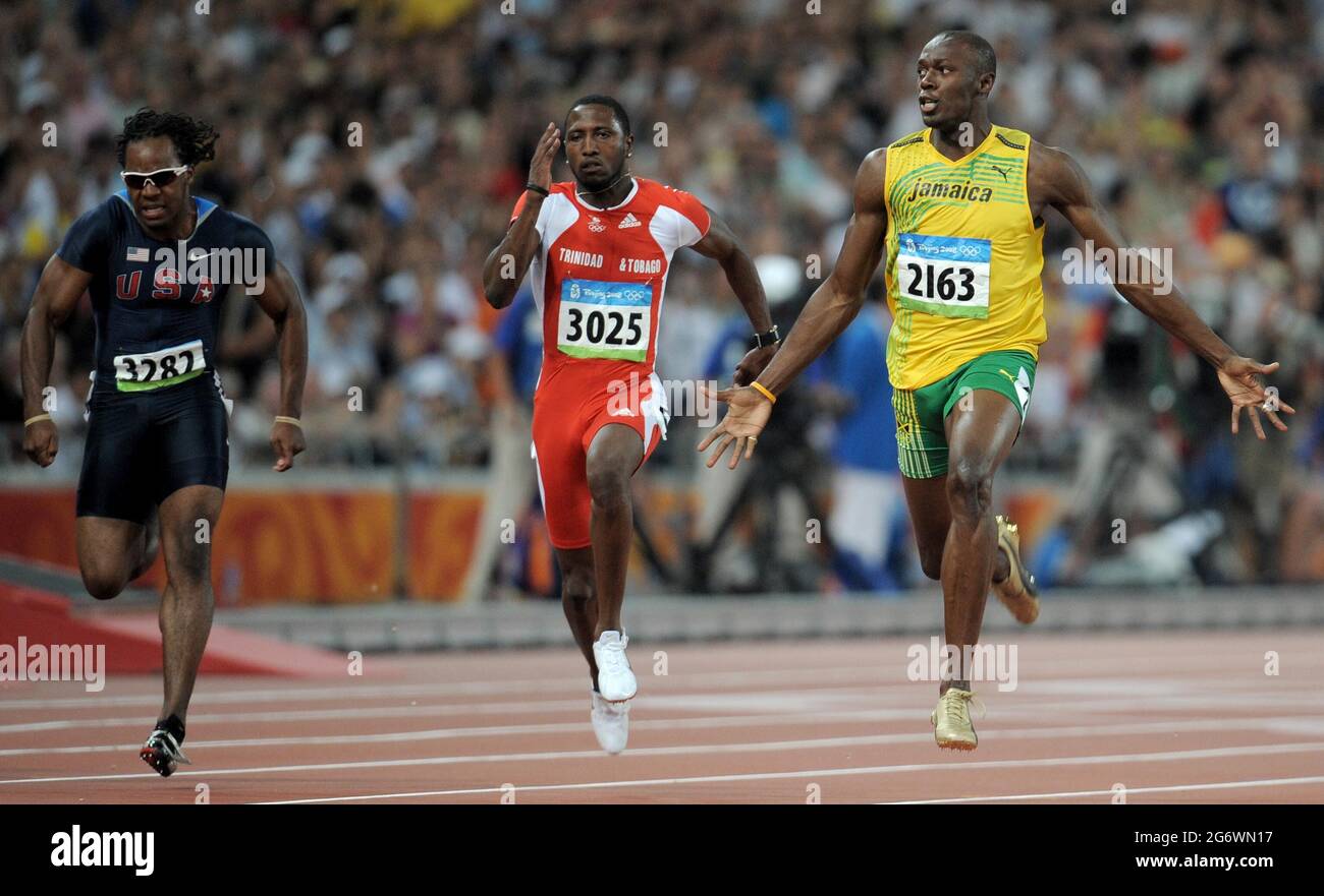 File photo dated 16-08-2008 of Jamaica's Usain Bolt (right) celebrates winning the gold medal and breaking the world record in the men's 100 metres final in the National Stadium during the 2008 Beijing Olympics in China. Issue date: Friday July 9, 2021. Stock Photo