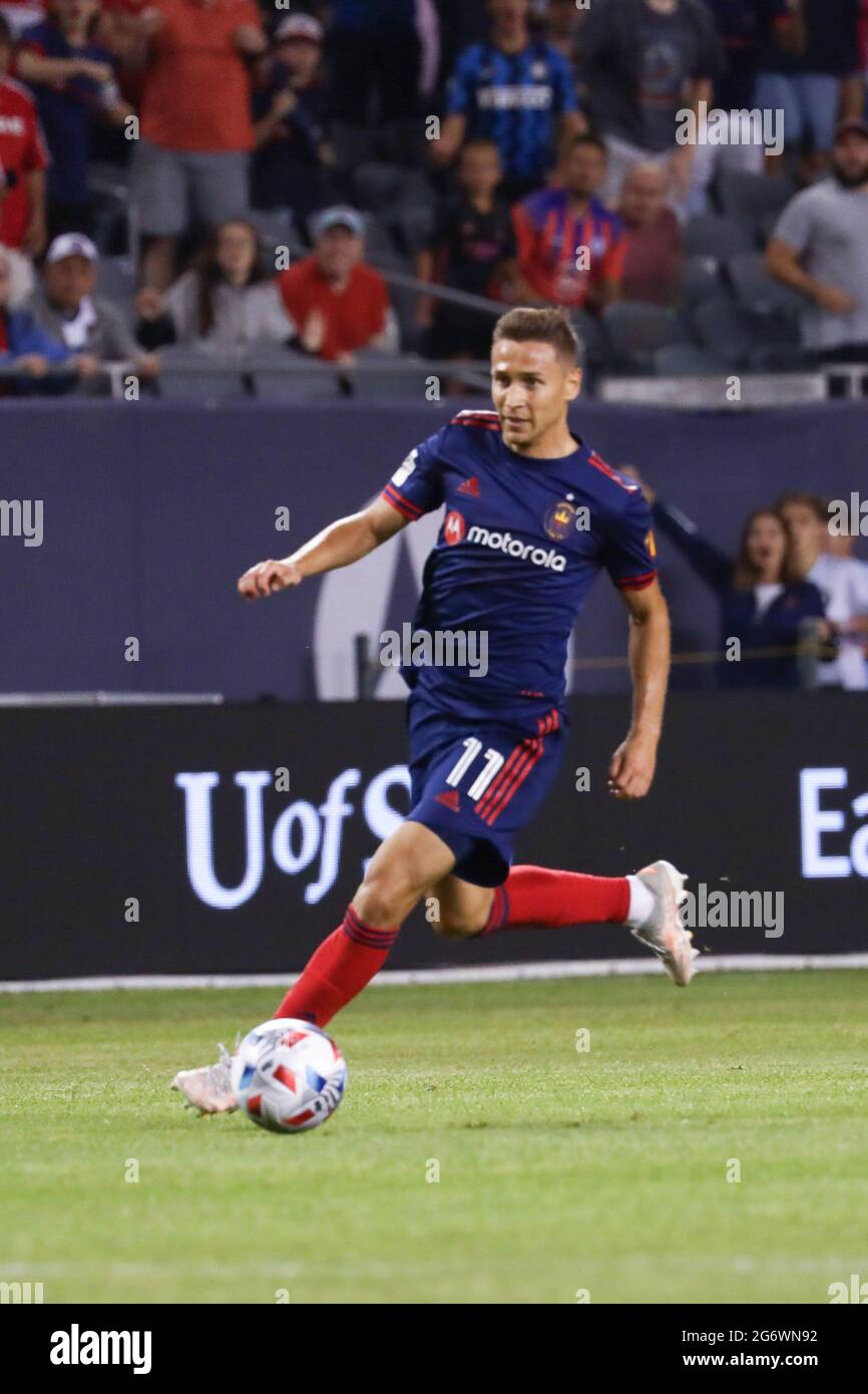 Chicago Fire midfielder Przemyslaw Frankowski (11) dribbles the ball during a MLS match against the Orlando City SC at Soldier Field, Wednesday, July Stock Photo