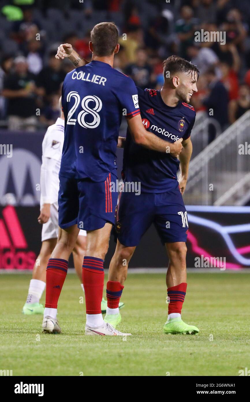 Chicago Fire midfielder Alvaro Medran (10) celebrates with  forward Elliot Collier (28) after a MLS match against the Orlando City SC at Soldier Field Stock Photo