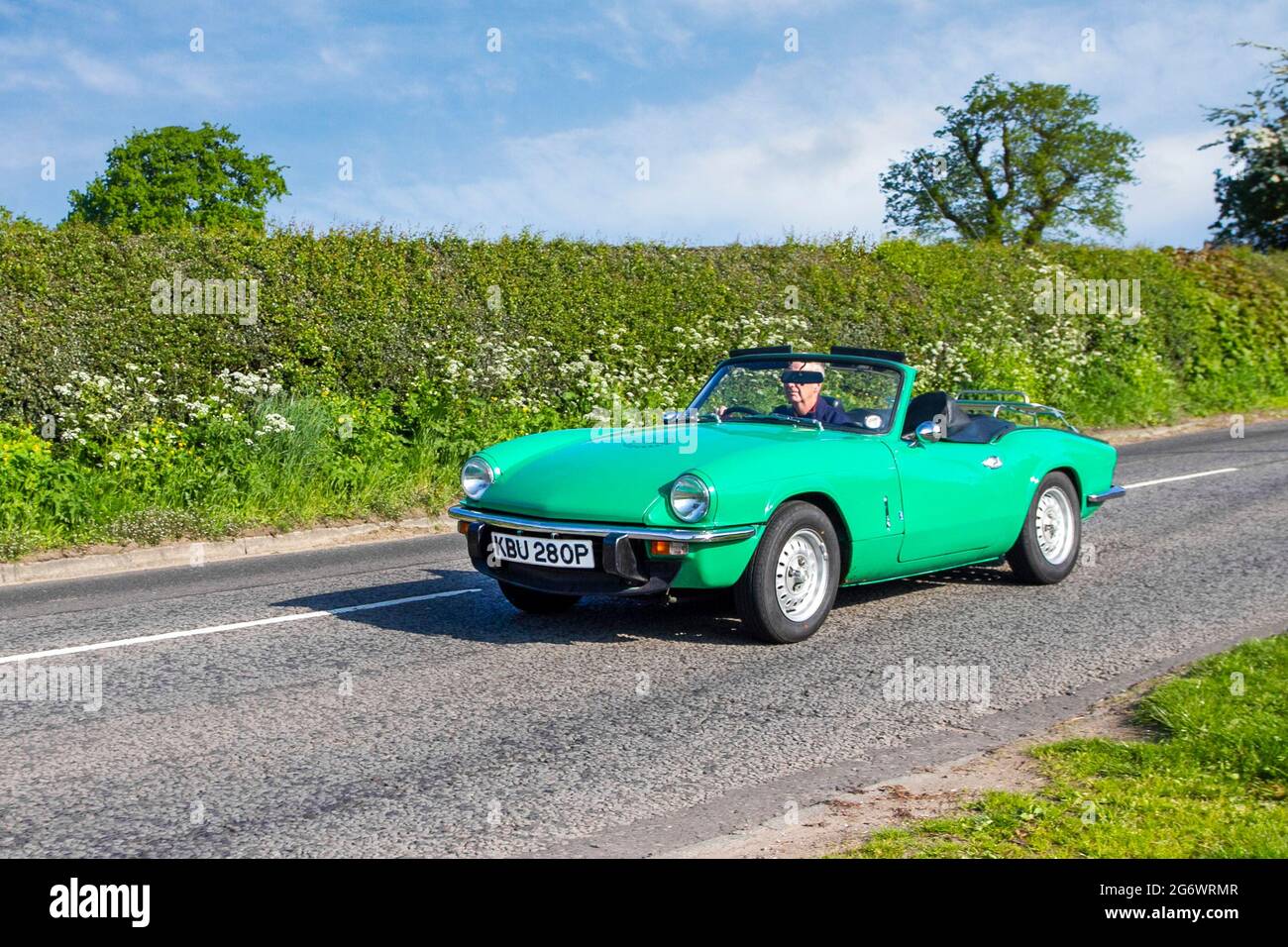 1975 70s green Triumph Spitfire 1403cc petrol cabrio British front-engined, rear-wheel drive, two-passenger convertible, en-route to Capesthorne Hall classic May car show, Cheshire, UK Stock Photo