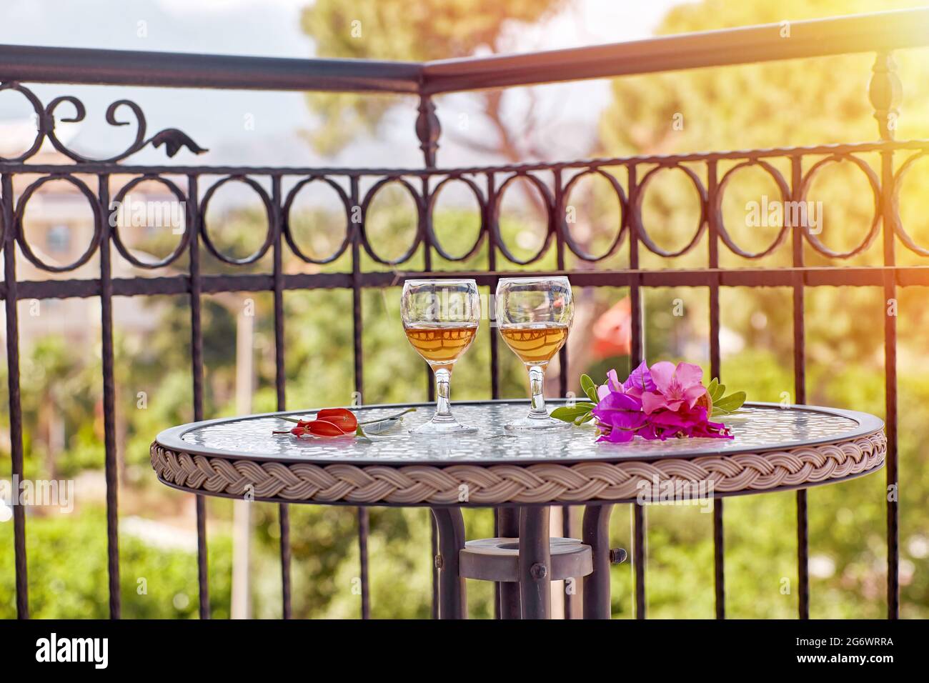 Beautiful summer cocktails and pink flowers of bougainvillea in front of Turkey flag and mountains. Travel Turkey concept. Romantic morning at the bal Stock Photo