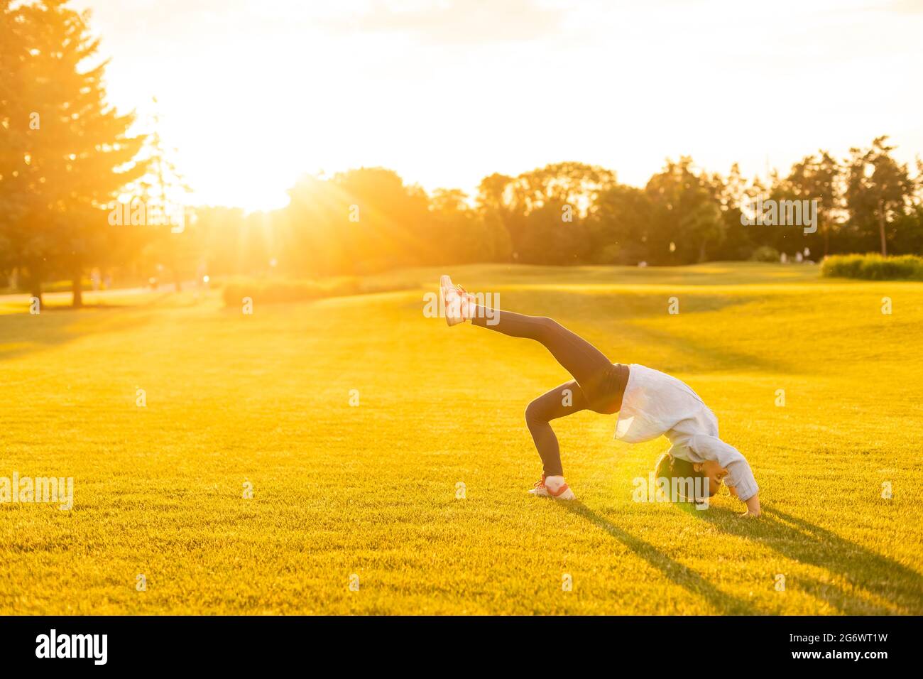 Cute little girl is playing in park Stock Photo - Alamy