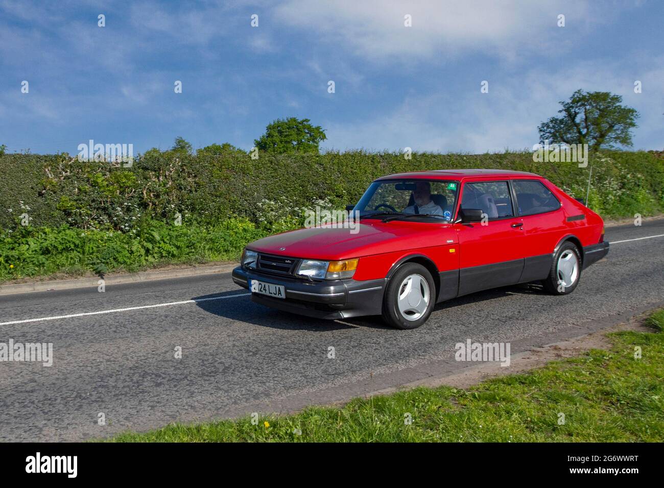 1991 90s red Saab S Aeroturbo 5 speed manual, 1985cc petrol 2dr saloon en-route to Capesthorne Hall classic May car show, Cheshire, UK Stock Photo