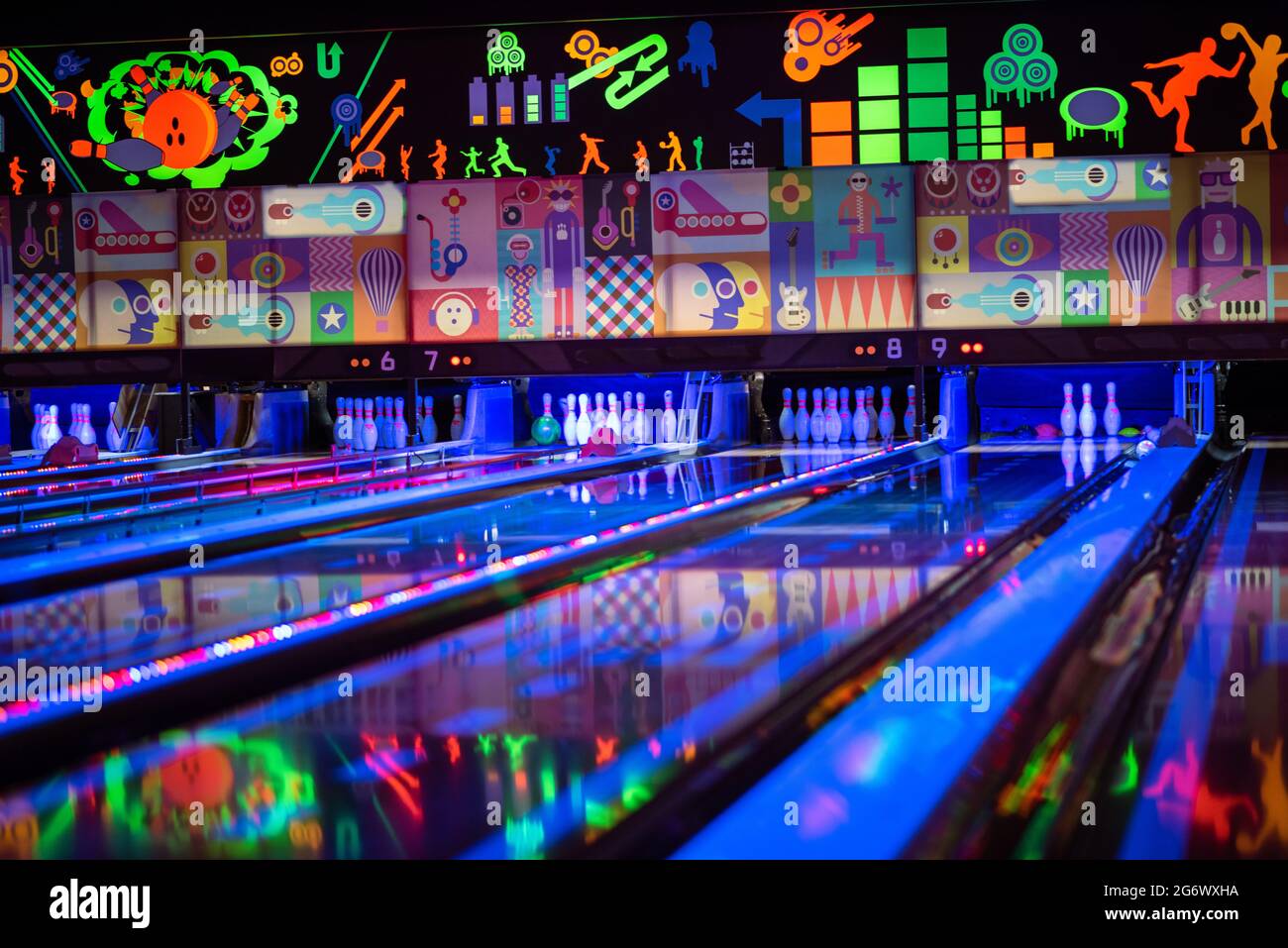 Tenpin bowling alley with neon colors Stock Photo - Alamy