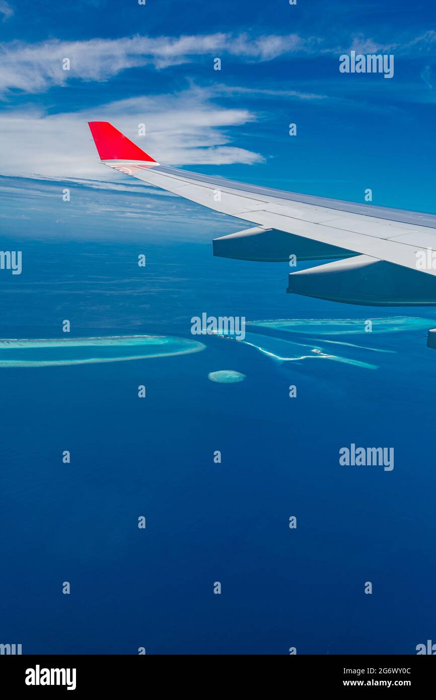 Maldives islands top view from airplane window. Idyllic exotic travel Stock Photo