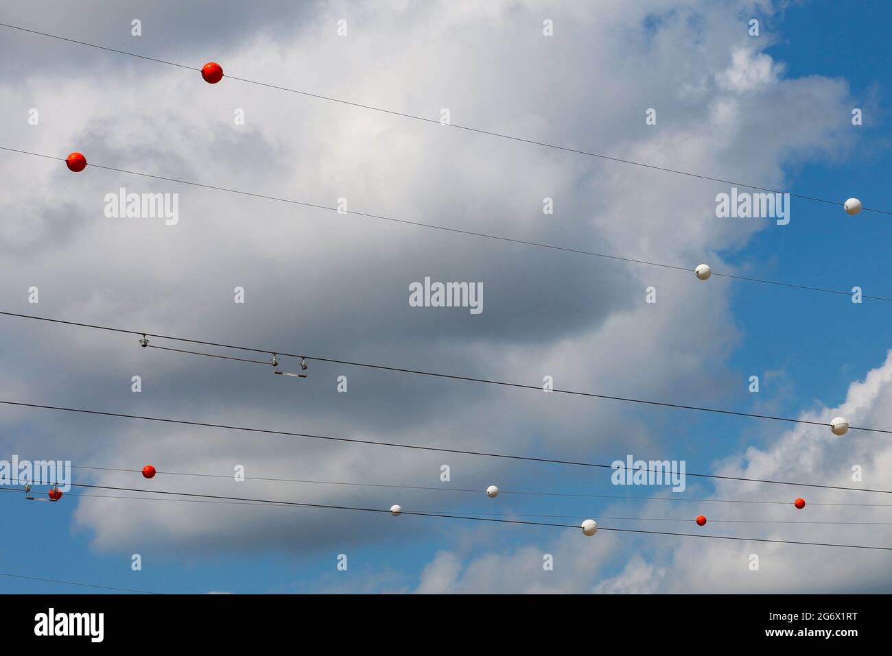 Electric wires with multicolored balls attached to them against the