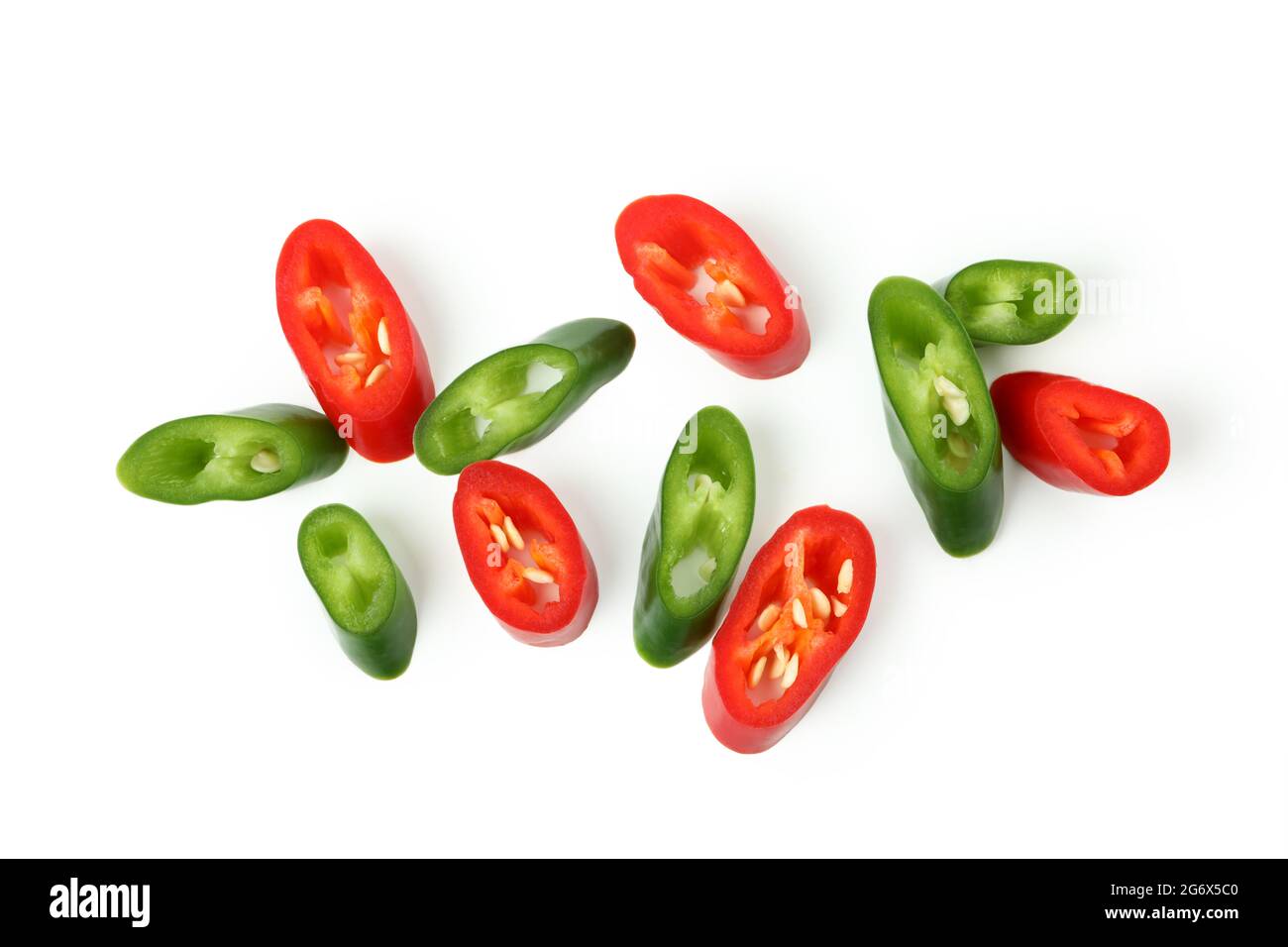 Green and red hot chili peppers slices isolated on white background ...