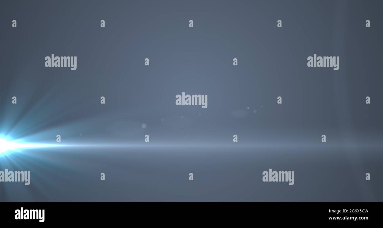 Glowing blue rays of light moving against grey background Stock Photo ...