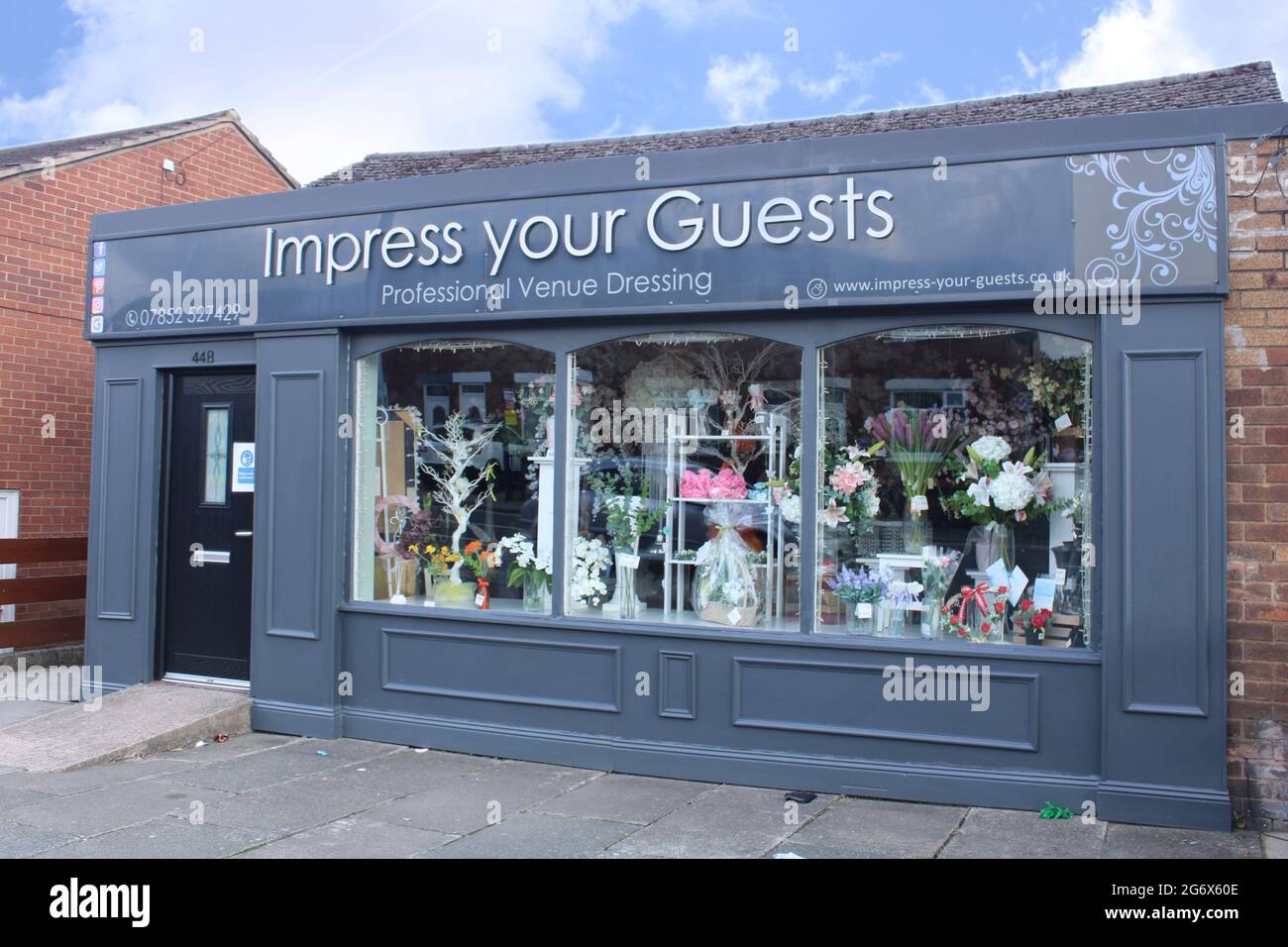 Professional venue dressing shop front with blue sky and copy space, Event dressing supplier: Lancashire, UK Stock Photo