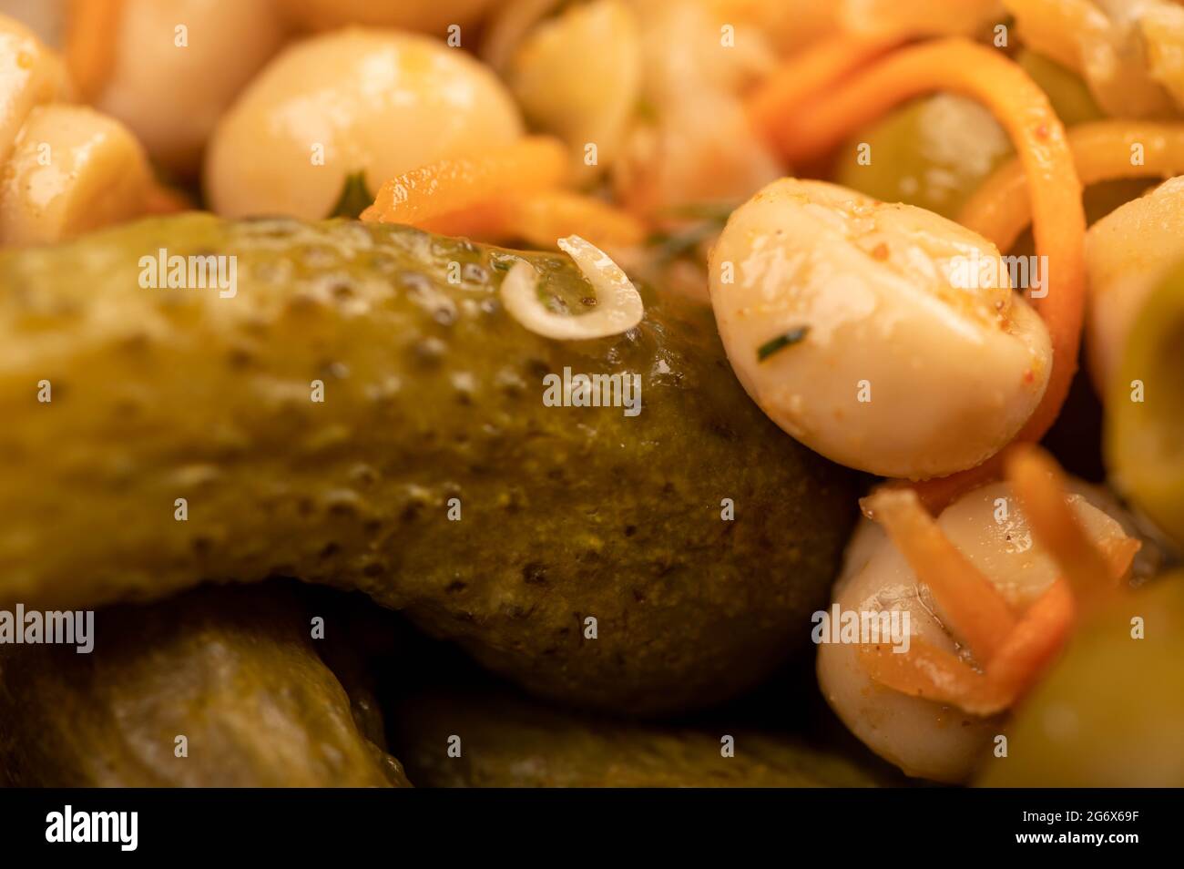 Pickled mushrooms and pickled cucumbers. Close-up Selective focus Stock Photo