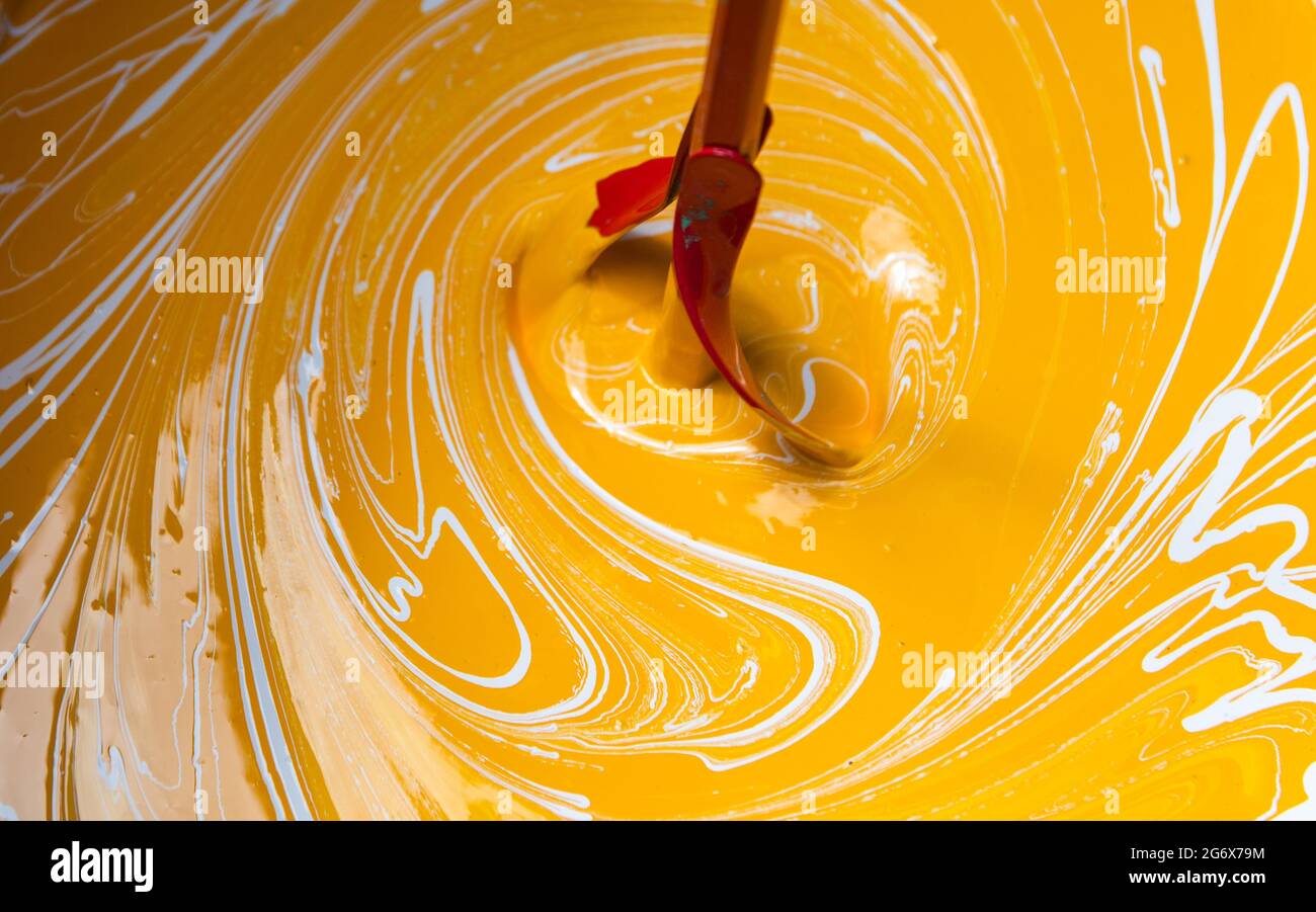 Paint stirring tool for mixing different color paint together. Mixing