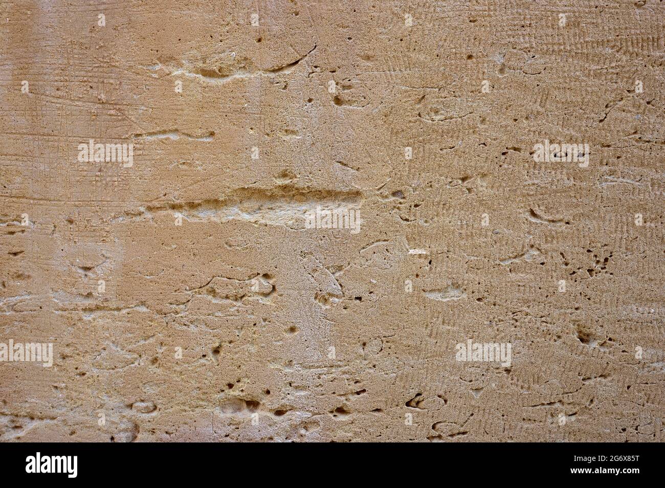 detail of a view of a piece of weathered and eroded natural stone wall ...