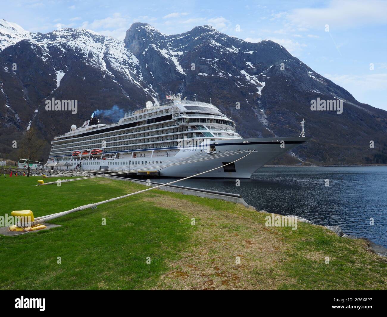 Viking Sky moored in the village of Eidfjord surrounded by mountains Stock Photo