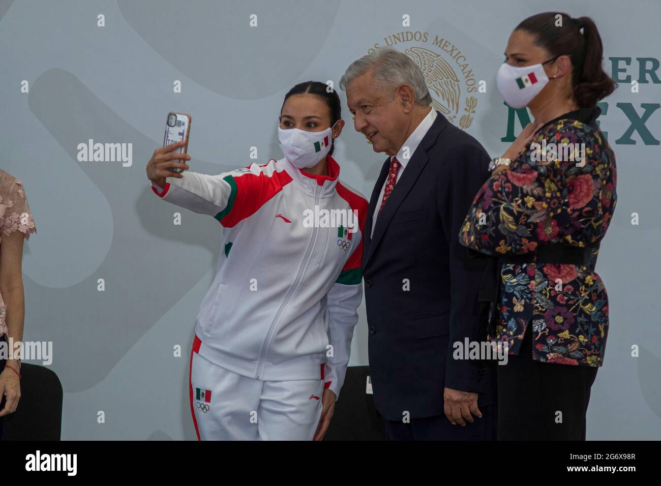 MEXICO CITY, MEXICO JULY 5:  Gymnast Rut Castillo takes a selfie with General Director of the National Commission for Physical Culture and Sports CONADE, Ana Gabriela Guevara and Mexico’s President Andres Manuel Lopez Obrador during the Ceremony of Flagging of the athletes who will represent Mexico towards the XXXII Olympic Games, Tokyo 2021 at National Center for the Development of Sports Talents and High Performance (CNAR) on July 5, 2021 in Mexico City, Mexico. Credit: Ricardo Flores/Eyepix Group/The Photo Access Stock Photo