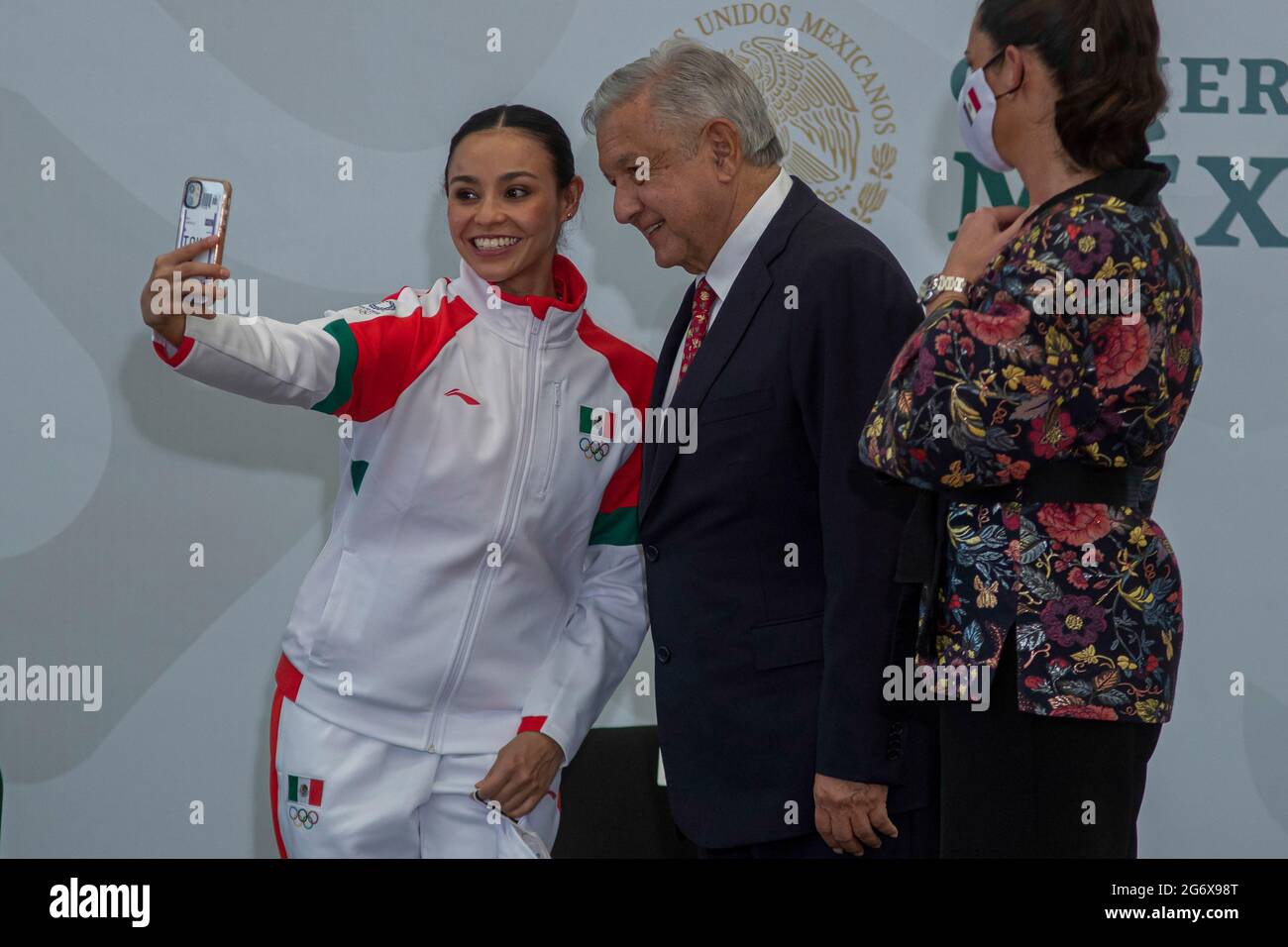 MEXICO CITY, MEXICO JULY 5:  Gymnast Rut Castillo takes a selfie with General Director of the National Commission for Physical Culture and Sports CONADE, Ana Gabriela Guevara and Mexico’s President Andres Manuel Lopez Obrador during the Ceremony of Flagging of the athletes who will represent Mexico towards the XXXII Olympic Games, Tokyo 2021 at National Center for the Development of Sports Talents and High Performance (CNAR) on July 5, 2021 in Mexico City, Mexico. Credit: Ricardo Flores/Eyepix Group/The Photo Access Stock Photo