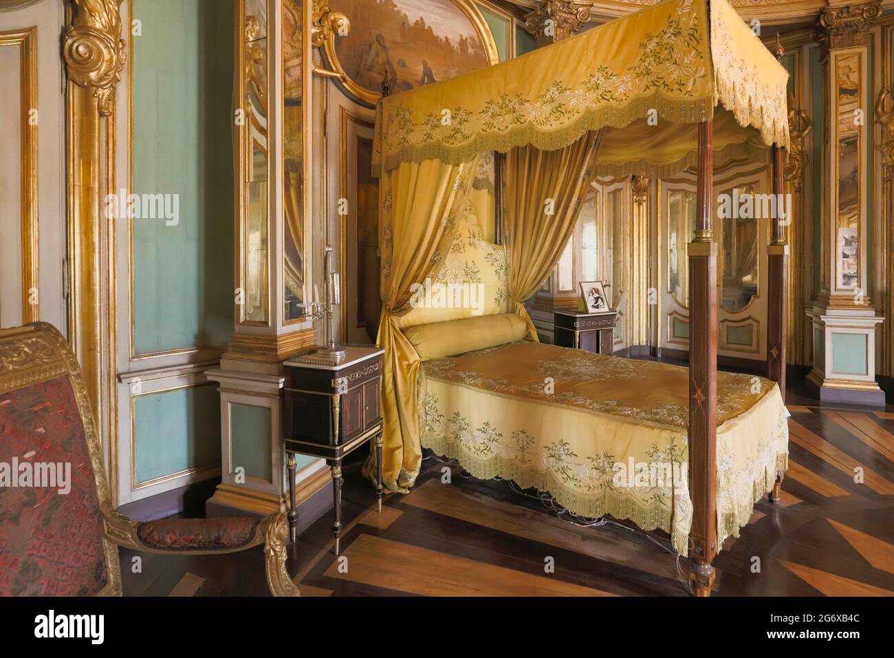 Queluz Palace, Sintra Municipality, Portugal.   Canopy bed in the Don Quixote chamber.   King Pedro I of Brazil and as Pedro IV of Portugal was born a Stock Photo