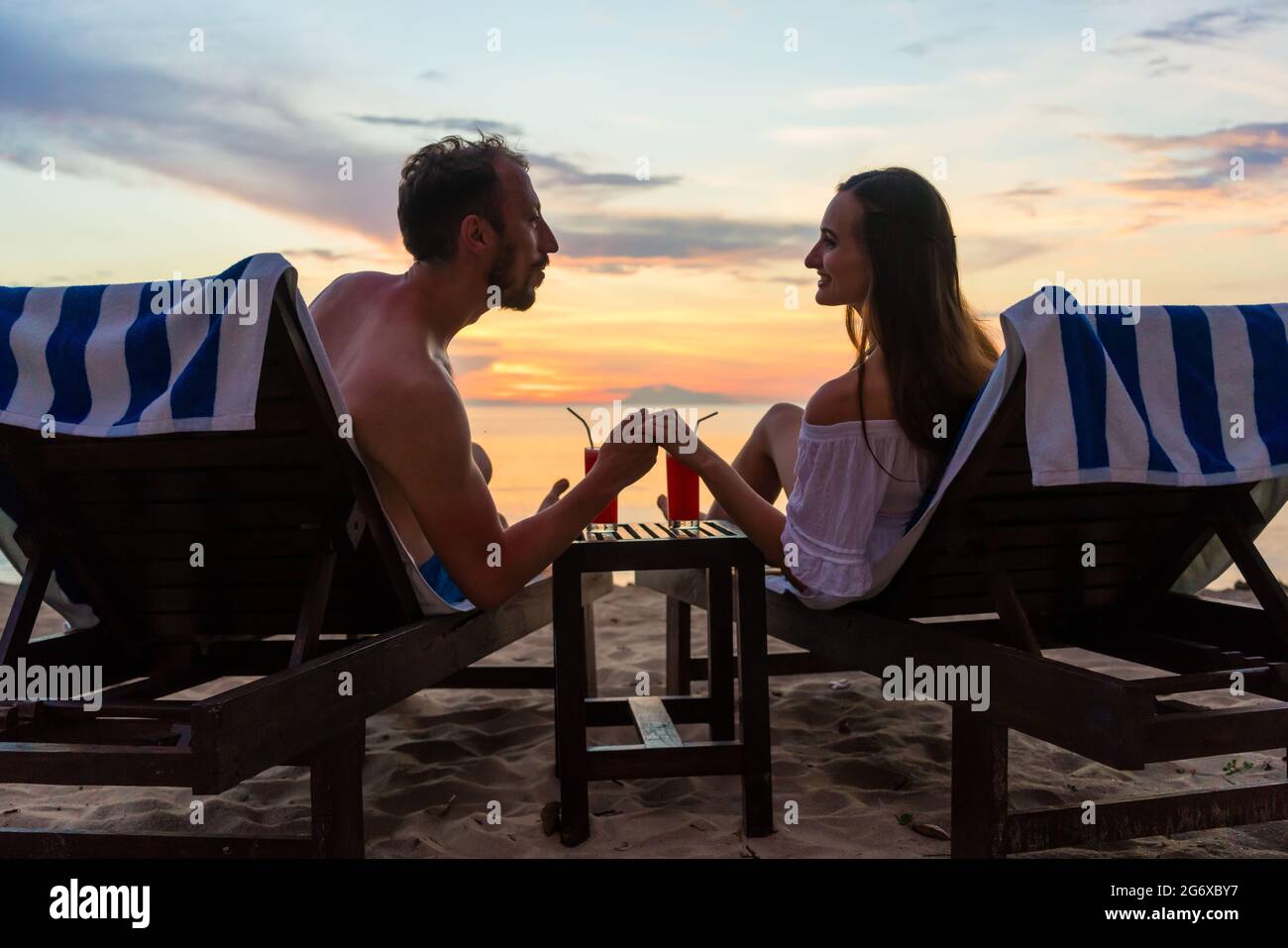 Woman chair sitting on beach watching hi-res stock photography and ...