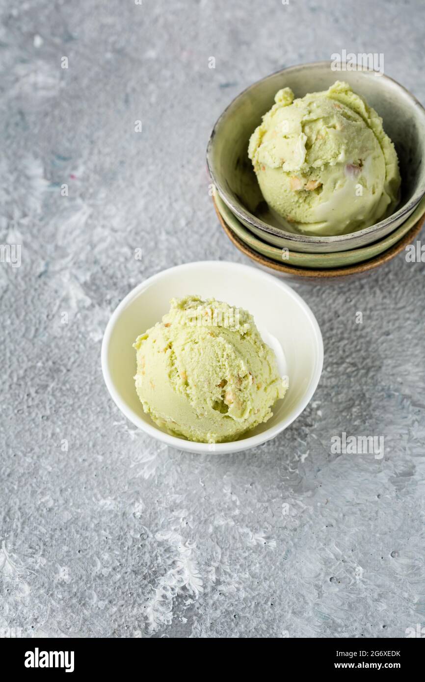 Pistachio ice cream scoops in smallbowl for party food Stock Photo Alamy