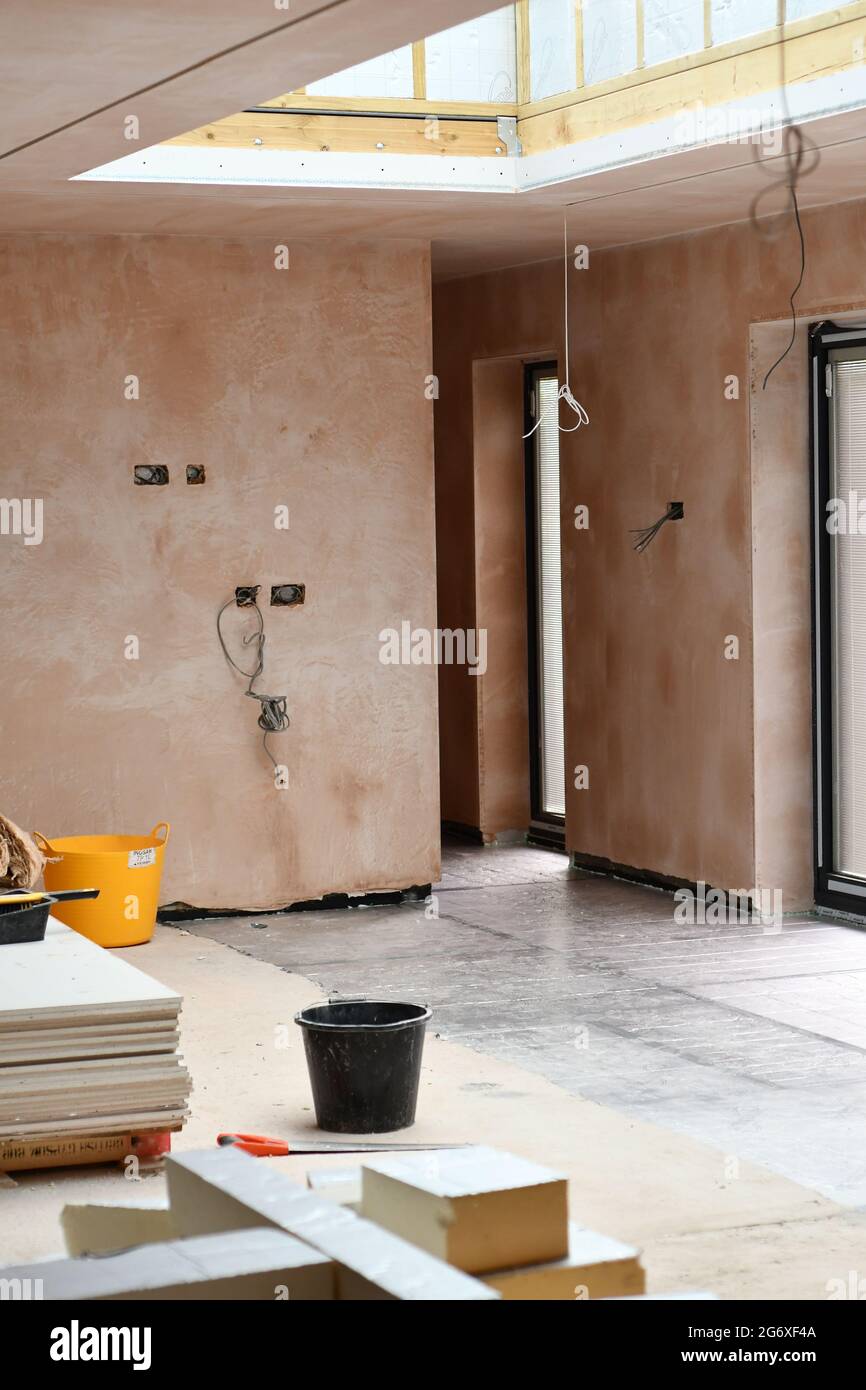 The interior of an ongoing renovation of an extension with a roof light ...