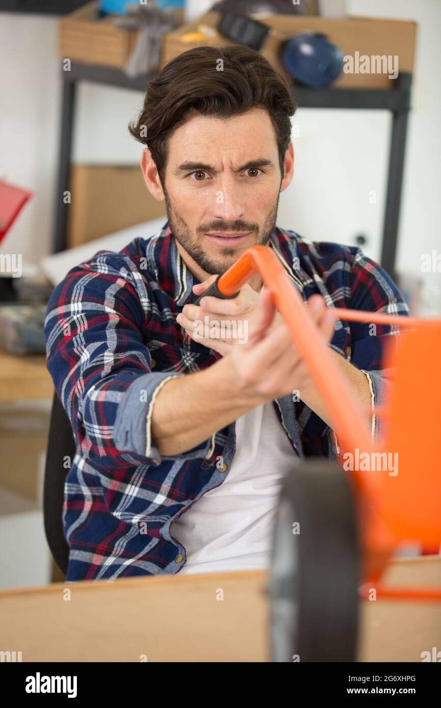 fixing trolley wheels Stock Photo Alamy