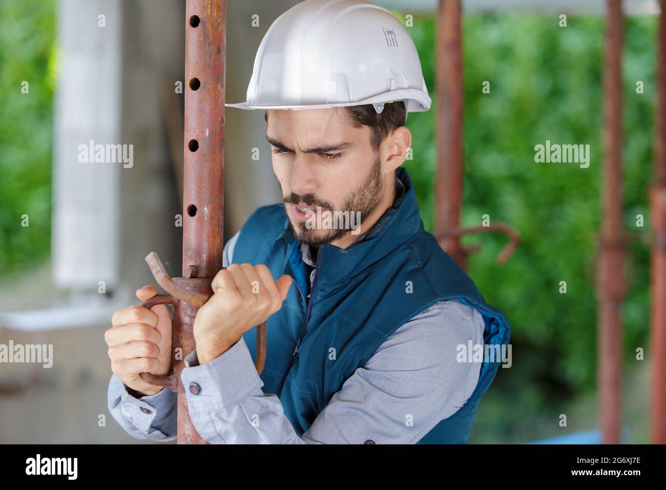 man working on a water pipe Stock Photo