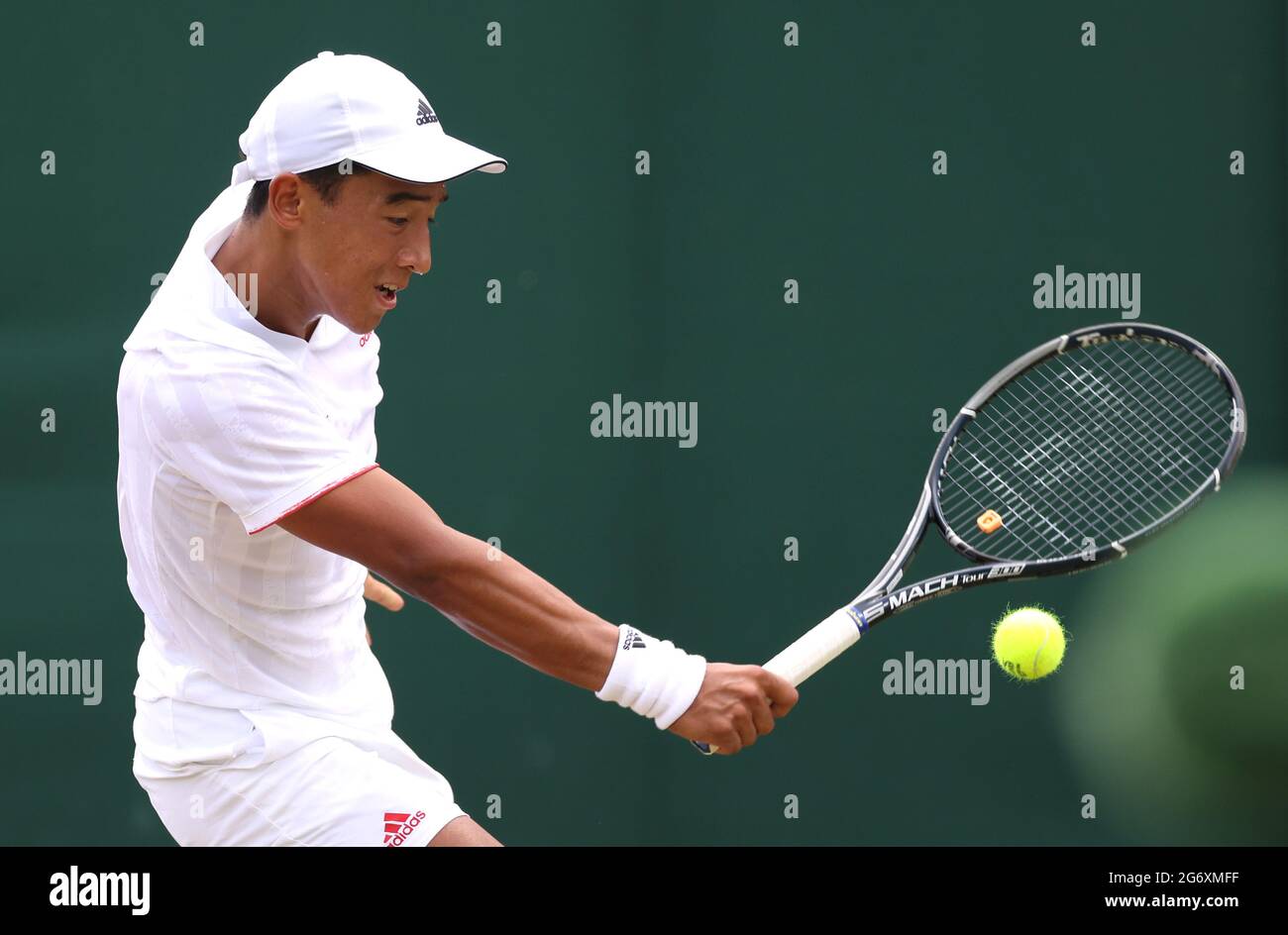 Bruno Kuzuhara in action against Max Westphal in the boy' singles third  round match on day eleven of Wimbledon at The All England Lawn Tennis and  Croquet Club, Wimbledon. Picture date: Friday