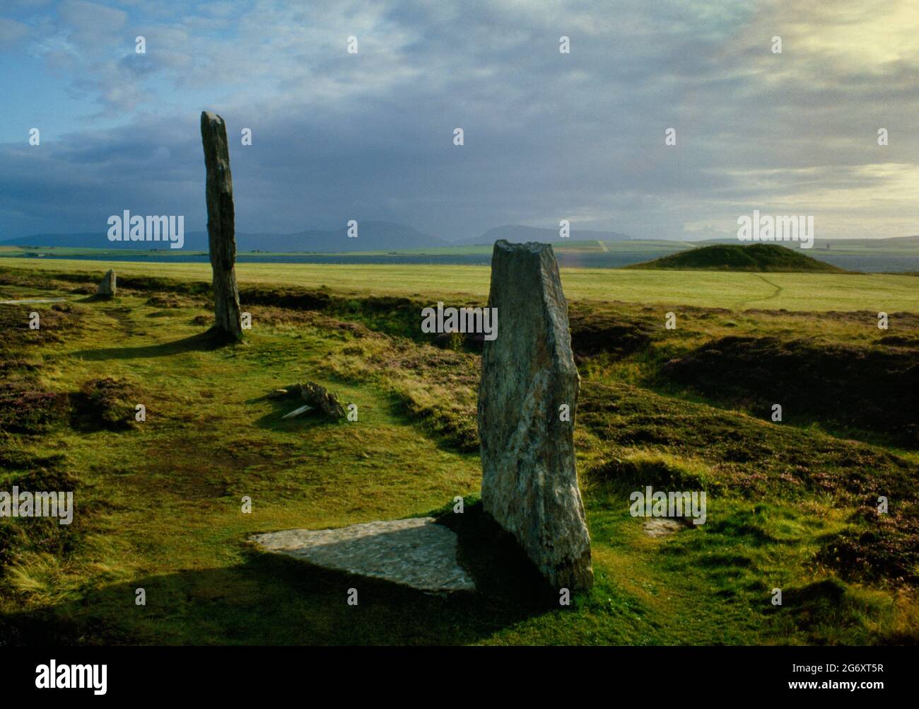 The Ring of Brodgar (Brogar) stone circle & henge monument on the Ness of Brodgar, Mainland, Orkney. Looking SW across the henge ditch to Salt Knowe. Stock Photo
