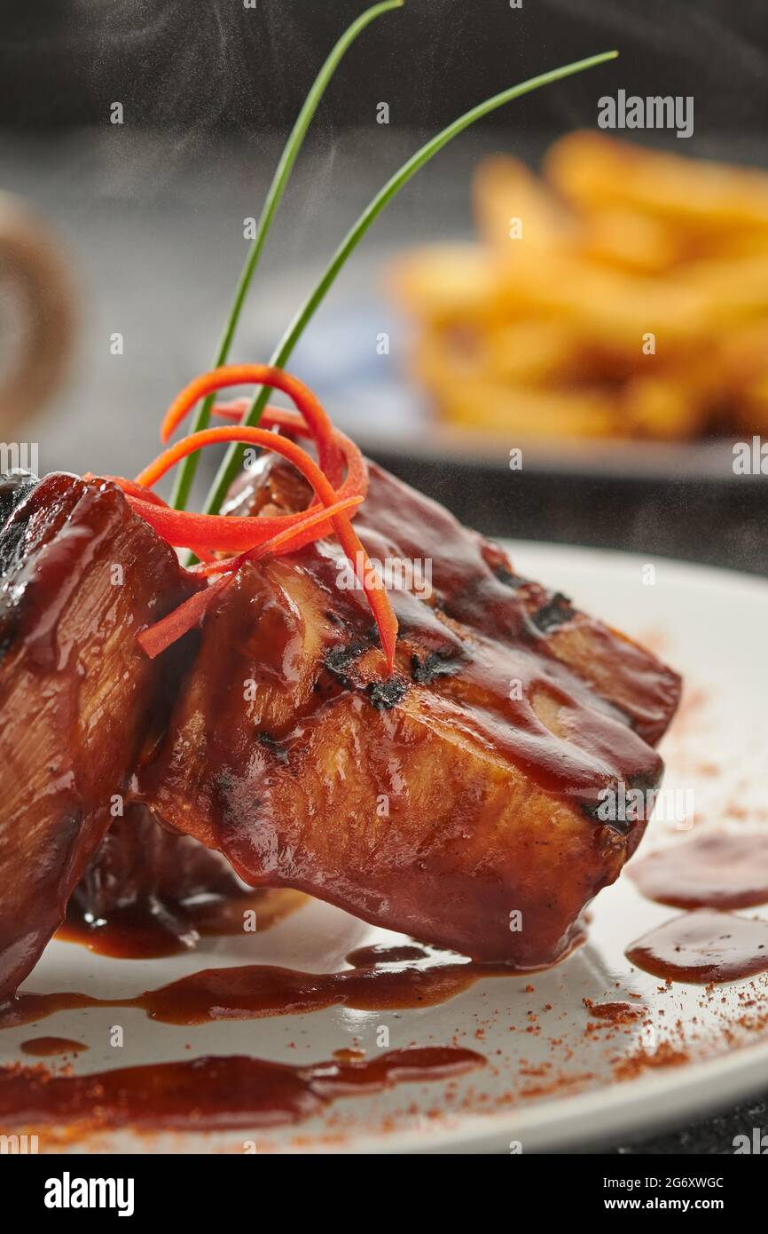 Costillas barbecue with sauce. Meat dish. Barbecue with sauce, selected focus. Stock Photo