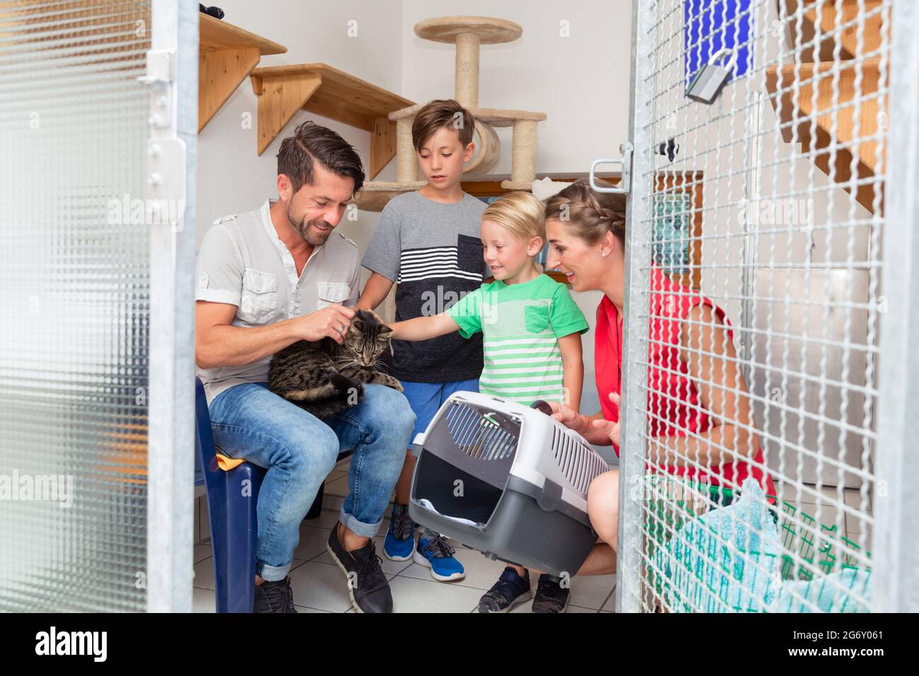 Family adopting cat from animal shelter taking her home Stock Photo Alamy