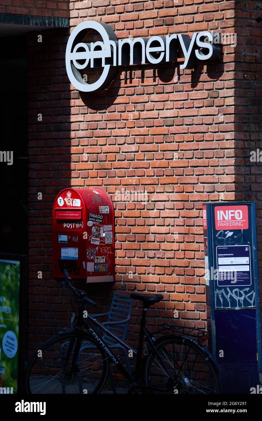 Emmerys (Danish organic bakery & cafe chain), sign on red brick wall, above letter box; Suhmsgade, Copenhagen, Denmark Stock Photo
