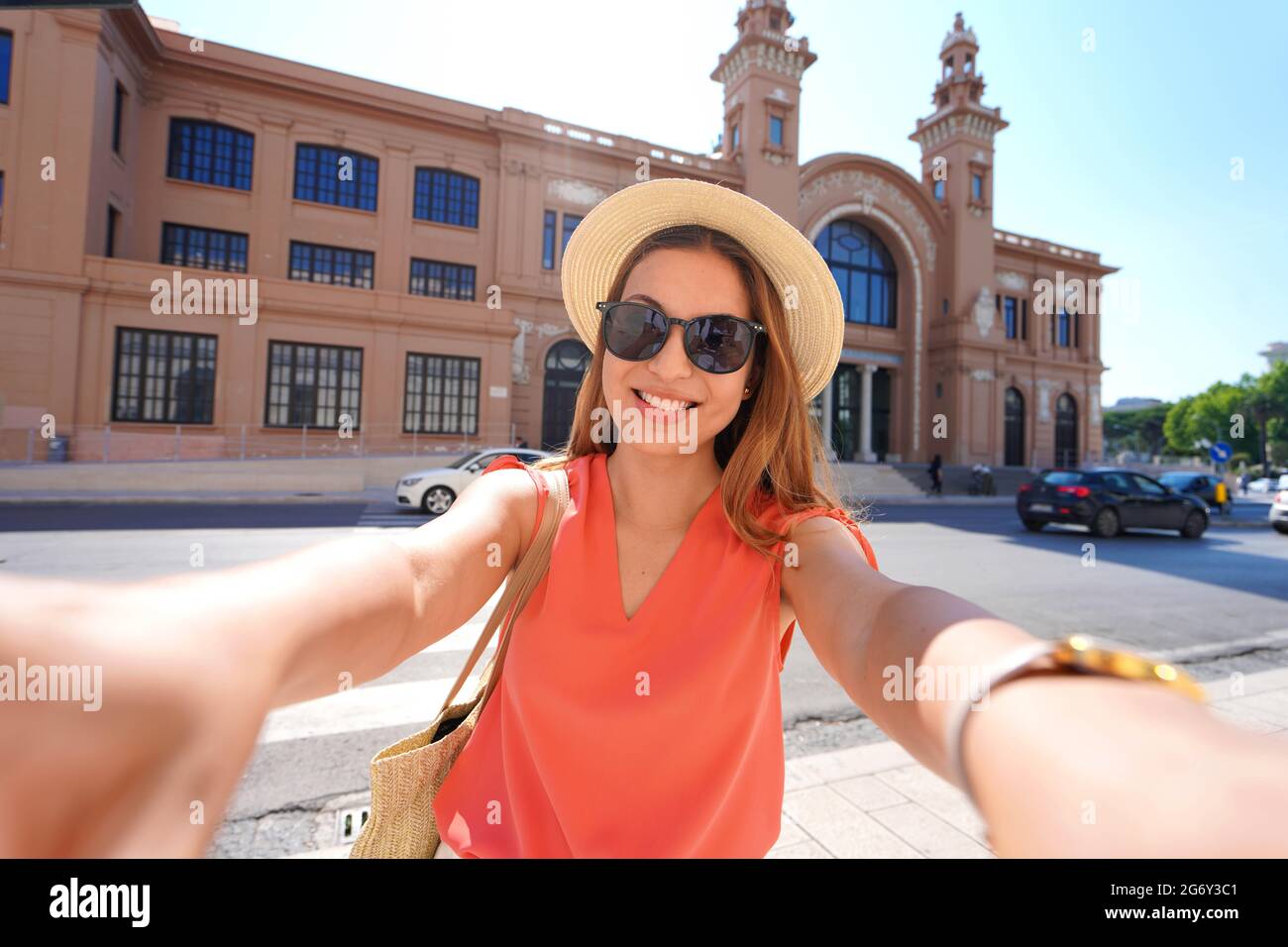 Visiting Bari. Self portrait of smiling young traveler woman enjoying visiting Bari, Apulia, Italy. Stock Photo