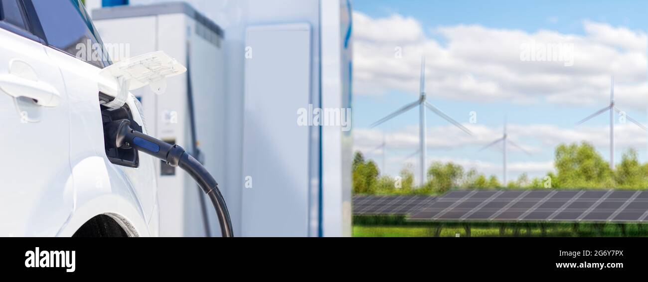 charging green energy for automobile to electric car for clean energy technology concept Stock Photo