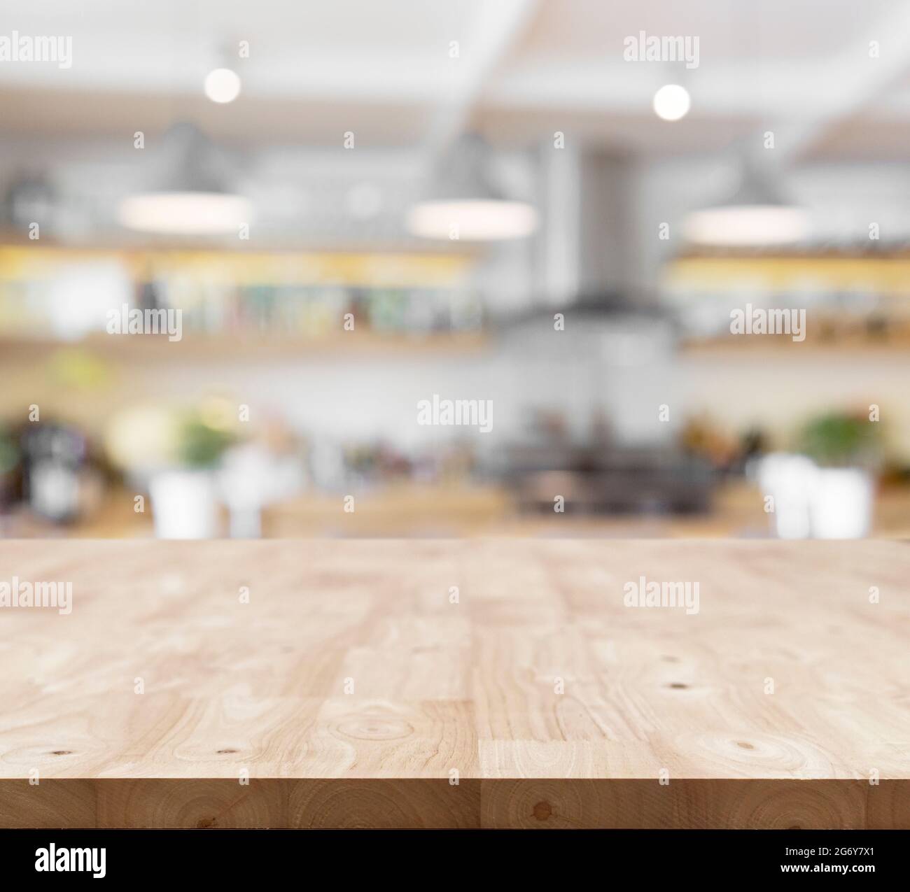 Modern wooden board empty table in front of blurred kitchen background . Perspective tabletop used for display or montage your products Stock Photo