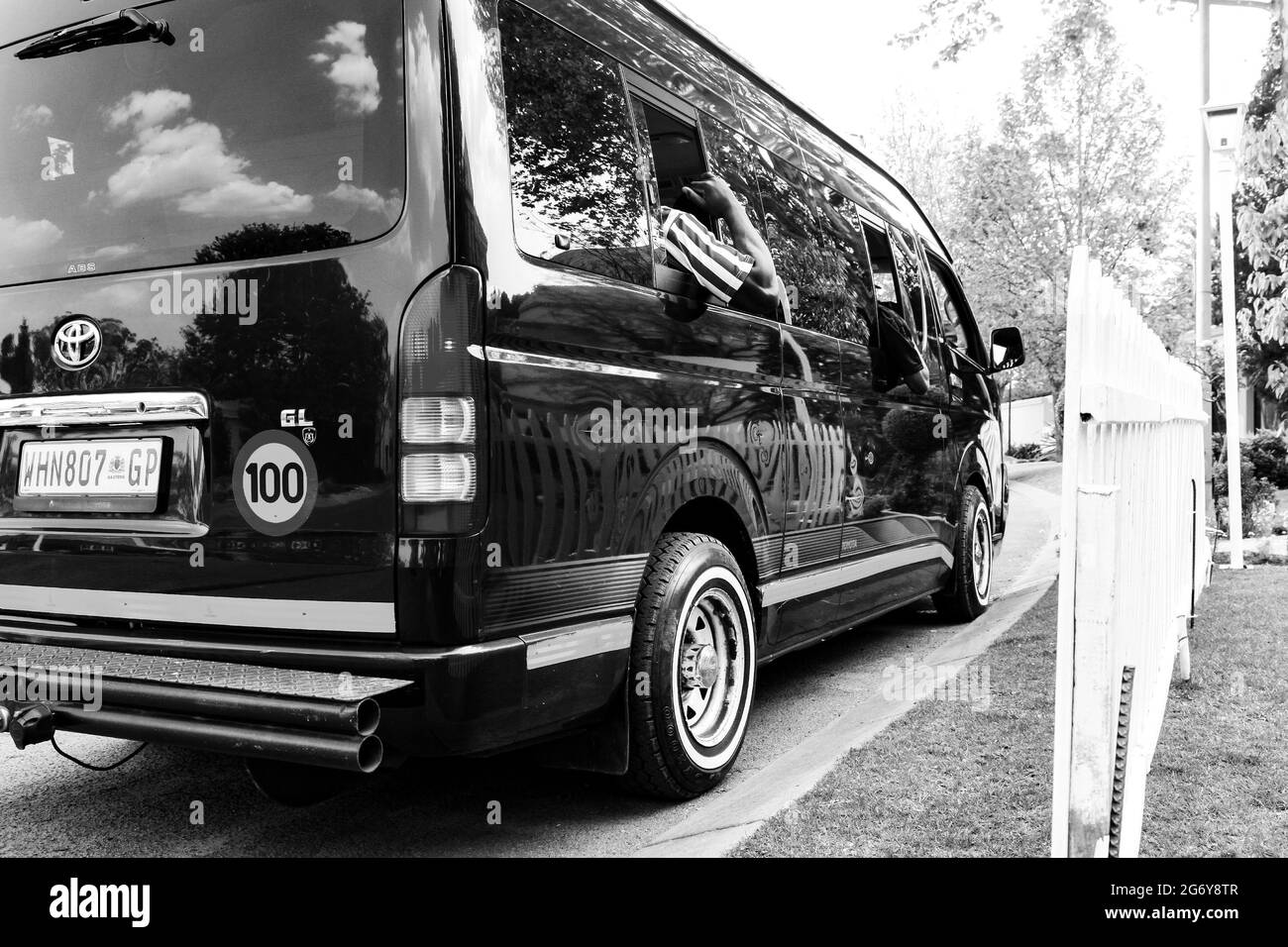 JOHANNESBURG, SOUTH AFRICA - Jan 06, 2021: Johannesburg, South Africa - September 10, 2010- Minibus taxi van parked outside a house in a wealthy neigh Stock Photo