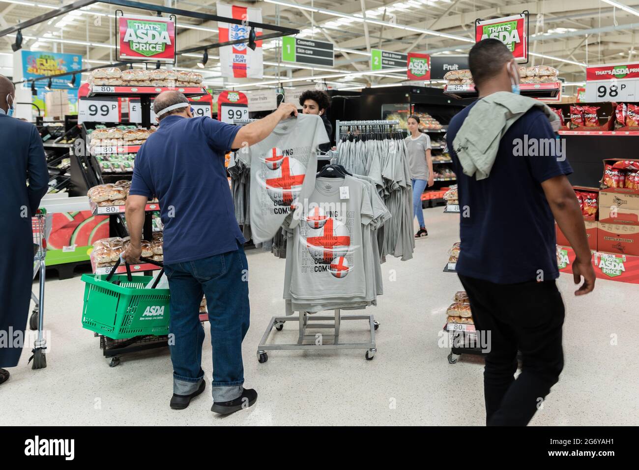 Wembley Stadium, Wembley Park, UK. 9th July 2021.  Football's Coming Home,  Wembley Park is buzzing with excitement ahead of Sundays match and local businesses get behind the England team.    Local Asda Superstore has exclusive 'It's Coming Home' shirts and St Georges Cross Hot Cross buns for sale in support of the England team.   60,000 fans are set to descend to Wembley Park to watch England play Italy in the UEFA EURO 2020 Finals at Wembley Stadium on Sunday 11th July.  Amanda Rose/Alamy Live News Stock Photo