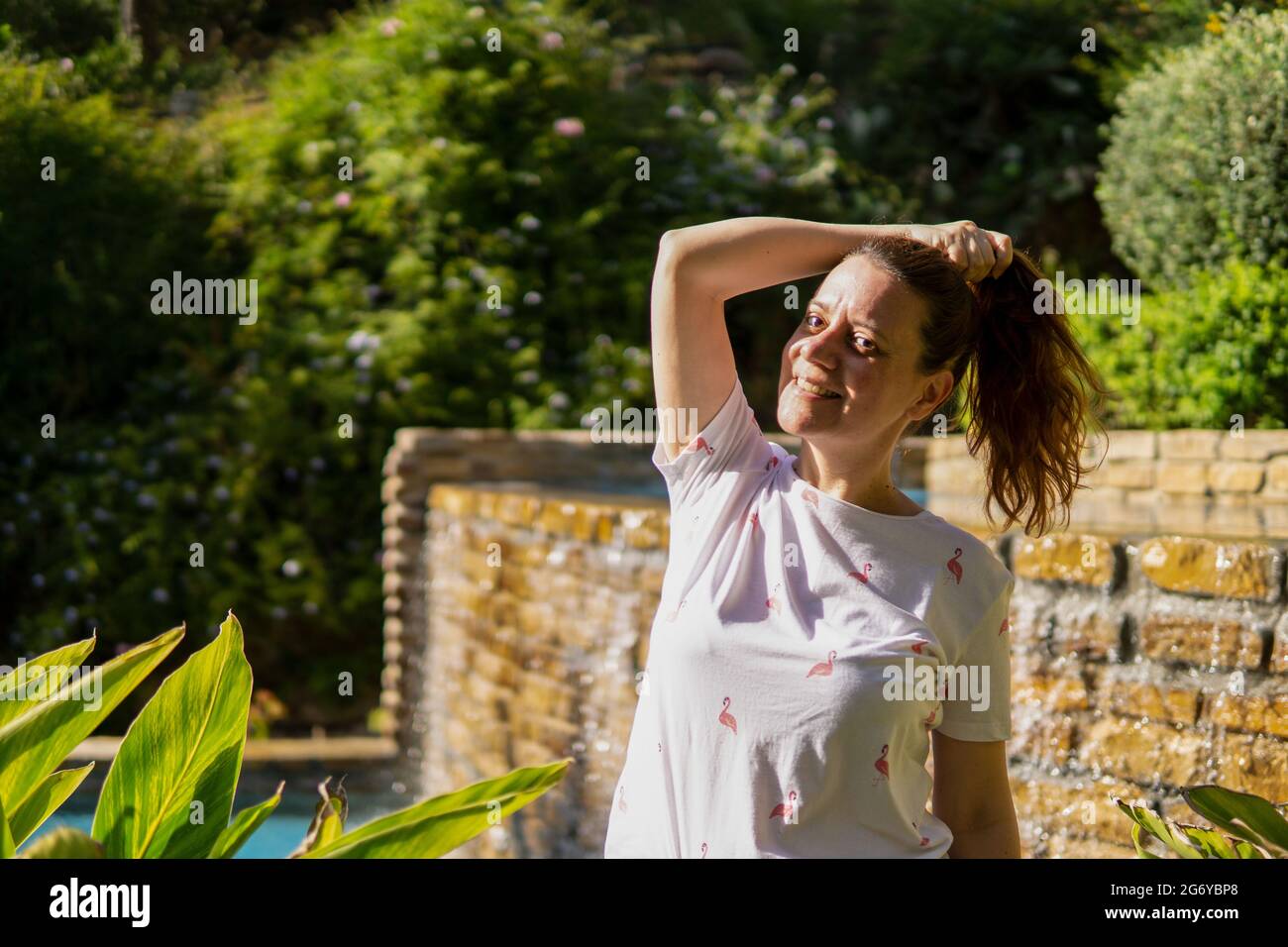 Happy woman standing outside hi-res stock photography and images - Alamy