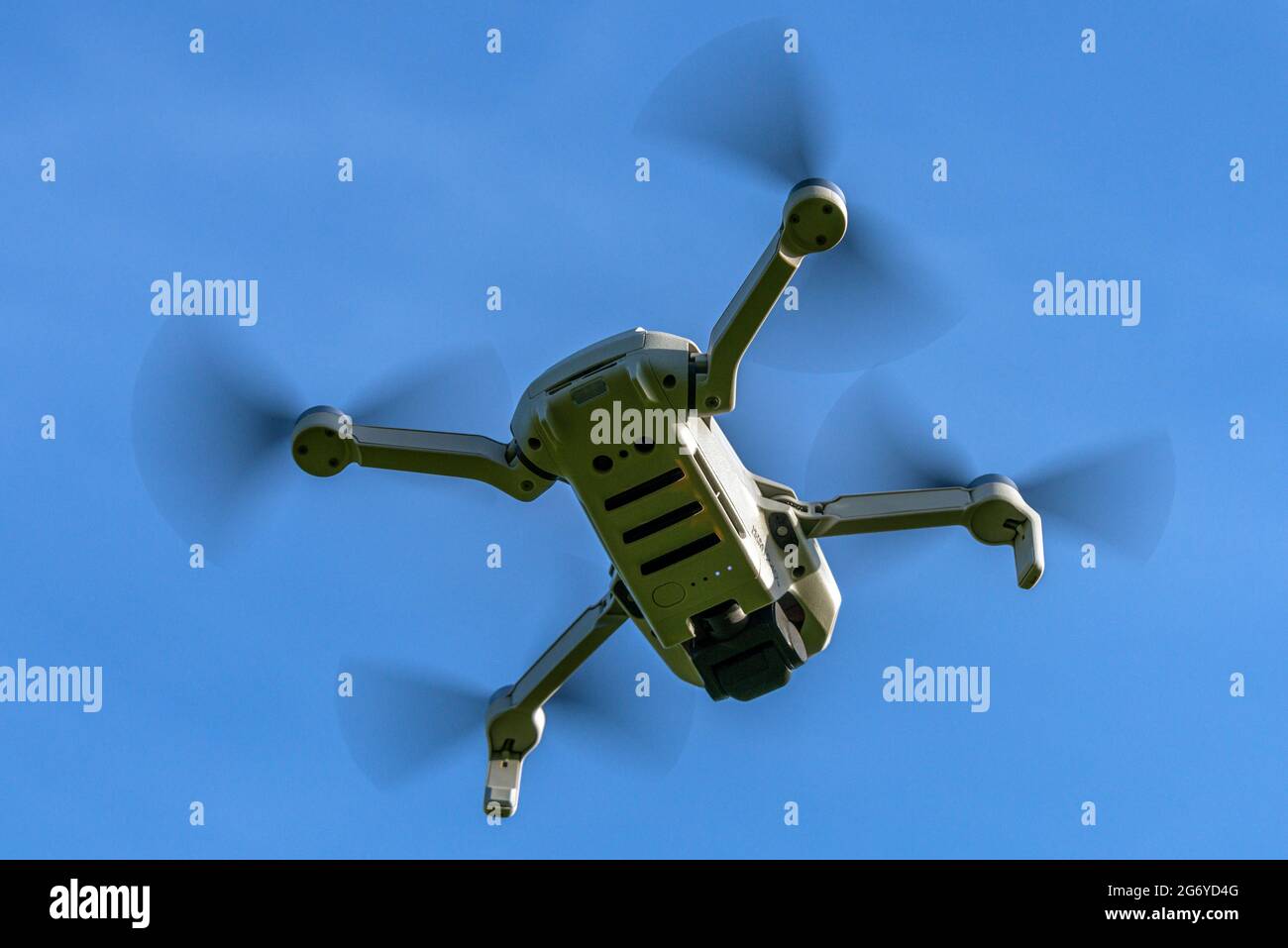 DJI Mavic Mini drone flying Stock Photo