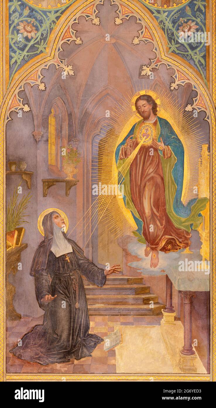 VIENNA, AUSTIRA - JUNI 24, 2021: The fresco of traditional Divine Mercy of Jesus in the Votivkirche church by brothers Carl and Franz Jobst Stock Photo