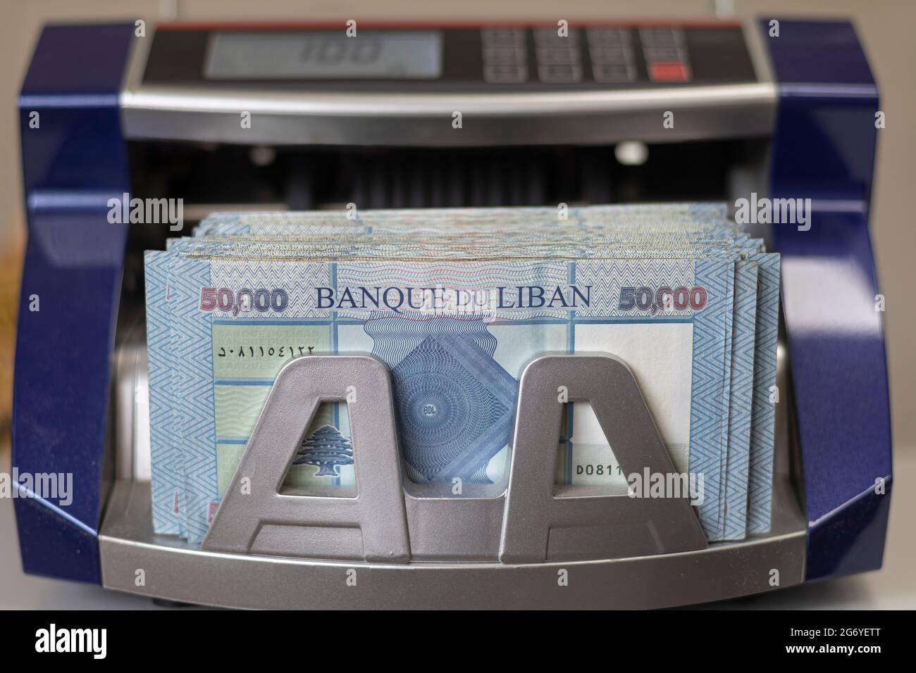 Lebanese Lira (Pound) Currency in a money counting machine. Stock Photo