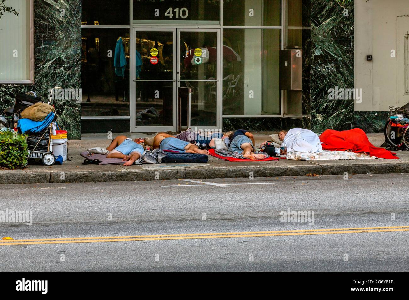 Early morning, homeless sleeping on downtown sidewalks in St