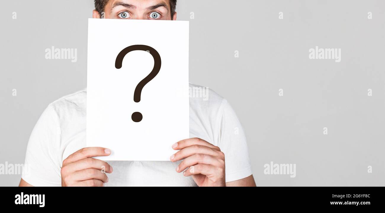 Anonymous man, peeking behind of interrogation symbol. Male incognita ...