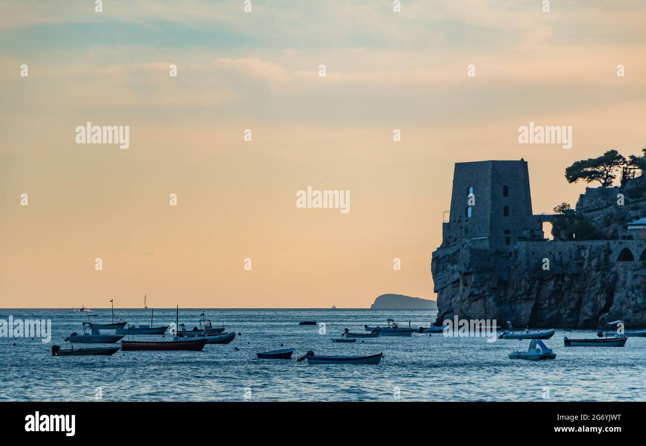 A picture of boats resting in Positano at sunset Stock Photo - Alamy