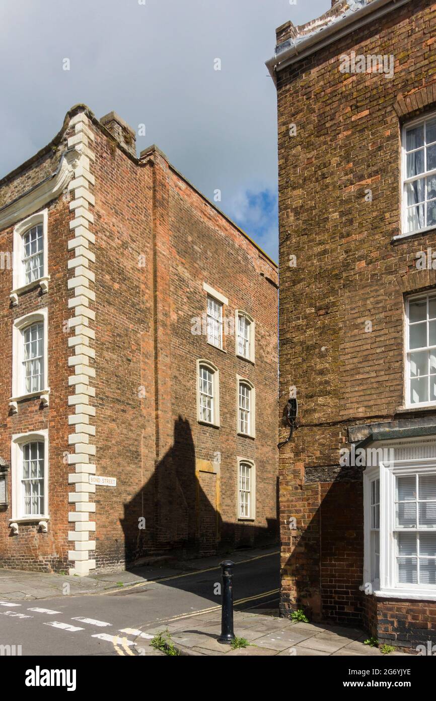 Early Georgian brick terraced houses of Castle Street, Bridgwater, Somerset, 1720s-30s, at junction with Bond Street. Stock Photo