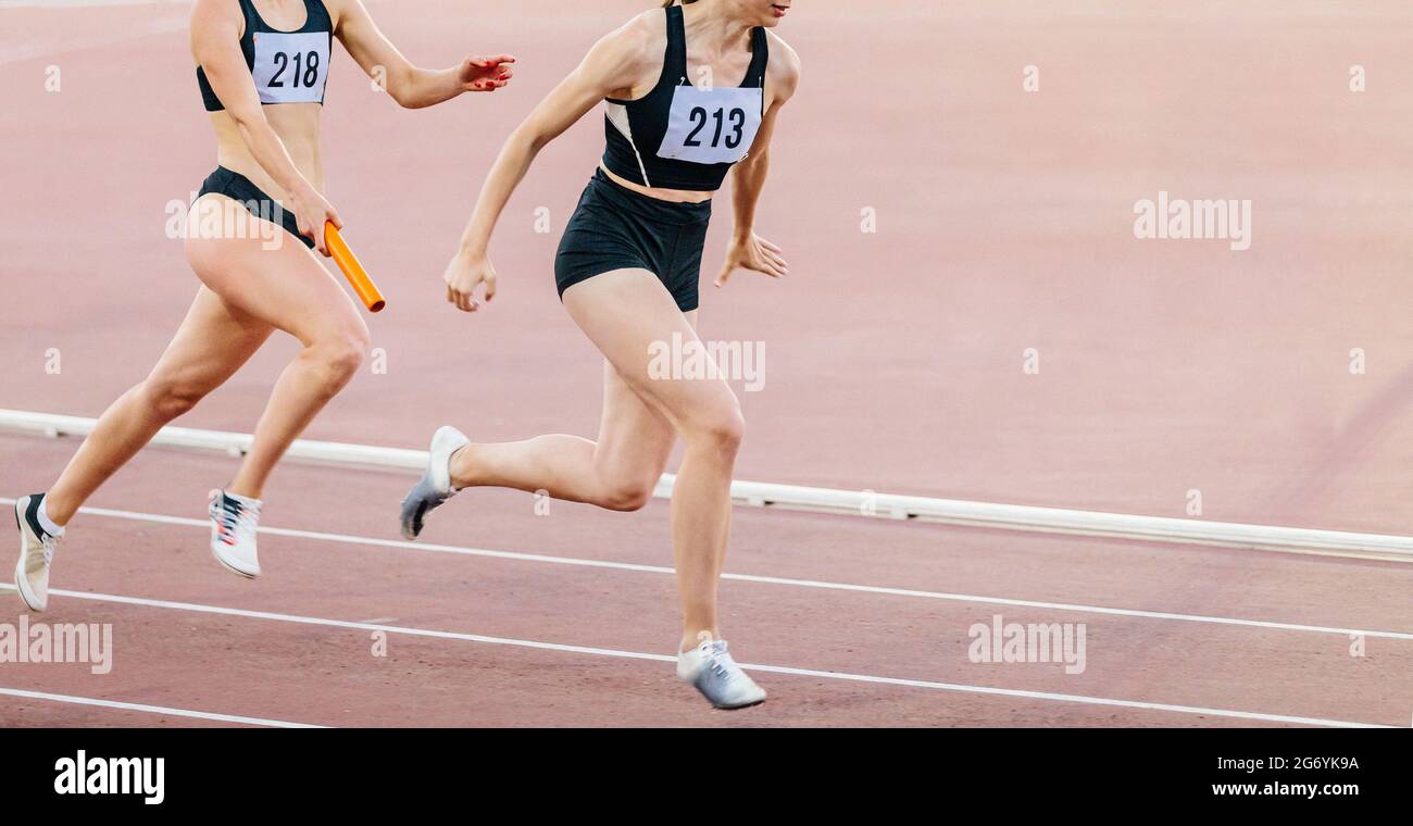 women relay race running track and field competition Stock Photo Alamy